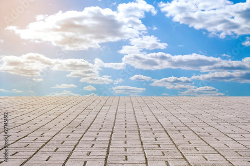 stone pavement tiles and sky with clouds 