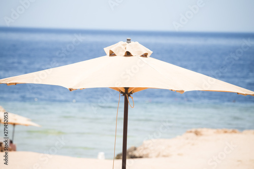 Relaxing Beach background with umbrellas and sea  © 2207918