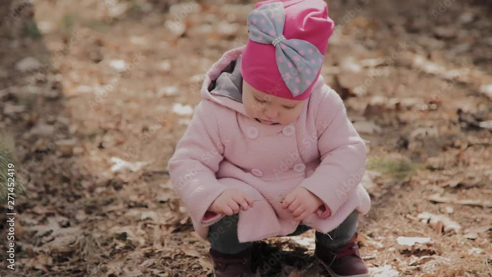 Beautiful little girl walking alone in the forest. Beautiful little girl walking alone in the forest.