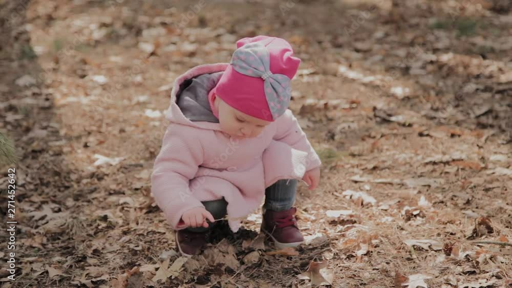 Beautiful little girl walking alone in the forest. Beautiful little girl walking alone in the forest.