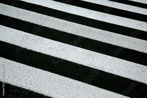 zebra crosswalk on a asphalt road background