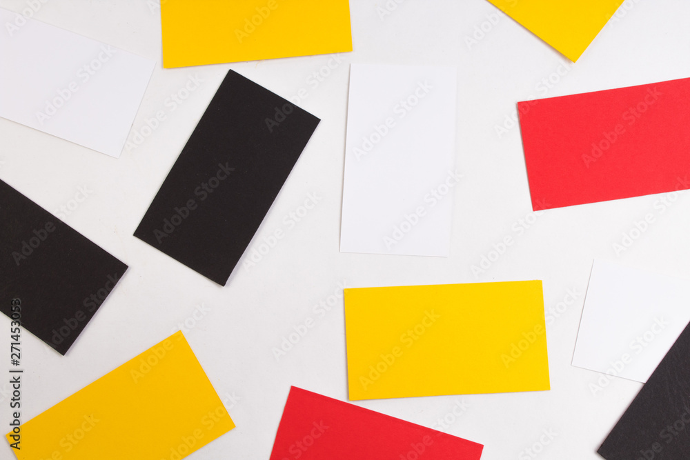 Heap of colorful credit cards at white textured paper background.. Top view. Heap of colorful credit cards at white textured paper background.. Top view.