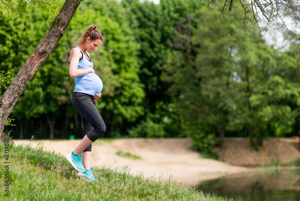 Pregnant woman fitness exercises outdoor Pregnant woman fitness exercises outdoor
