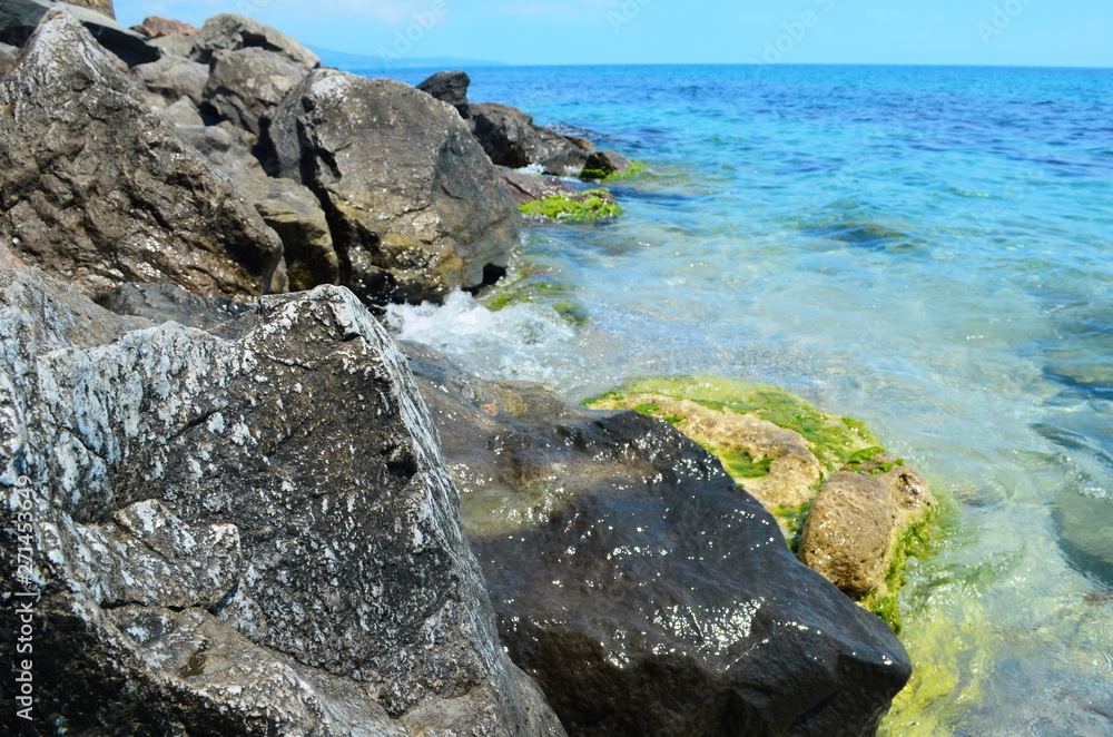 Crystal blue Black Sea and stones in Bulgaria, Nessebar island