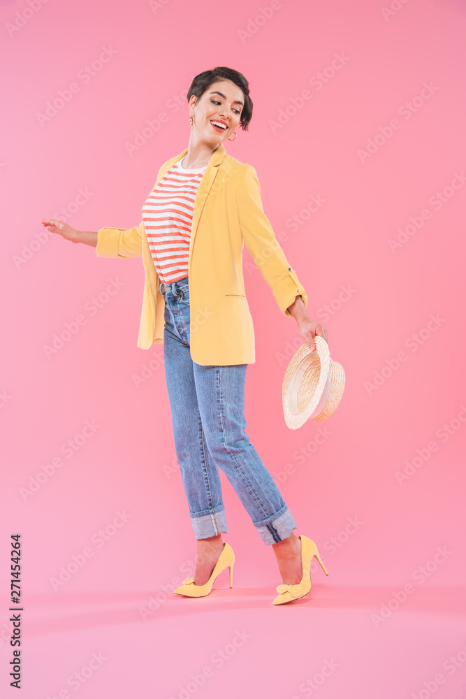 attractive mixed race woman in bright clothing posing at camera on pink background attractive mixed race woman in bright clothing posing at camera on pink background