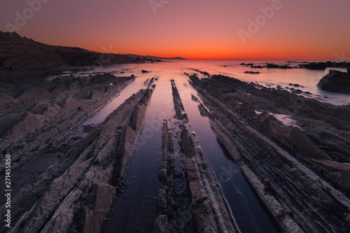 Beach of Itzurun at Zumaia with the famous flysch coast, Basque Country. photo