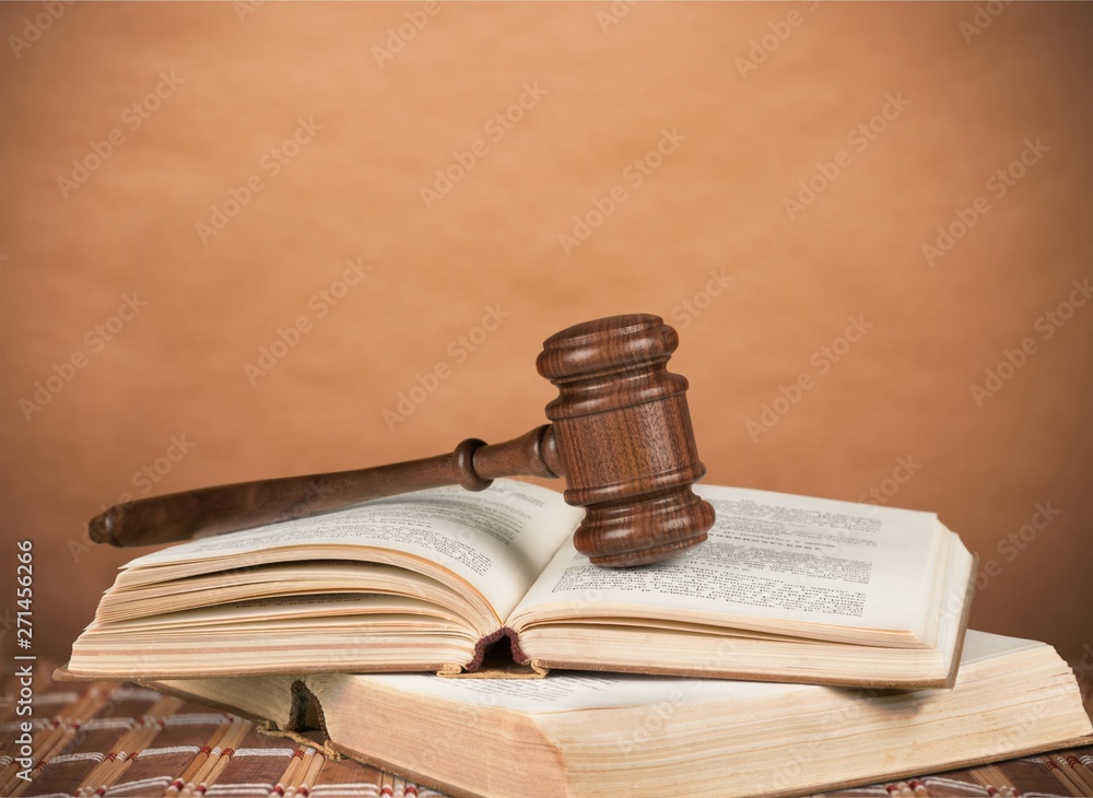 Books and wooden gavel on wooden table Books and wooden gavel on wooden table