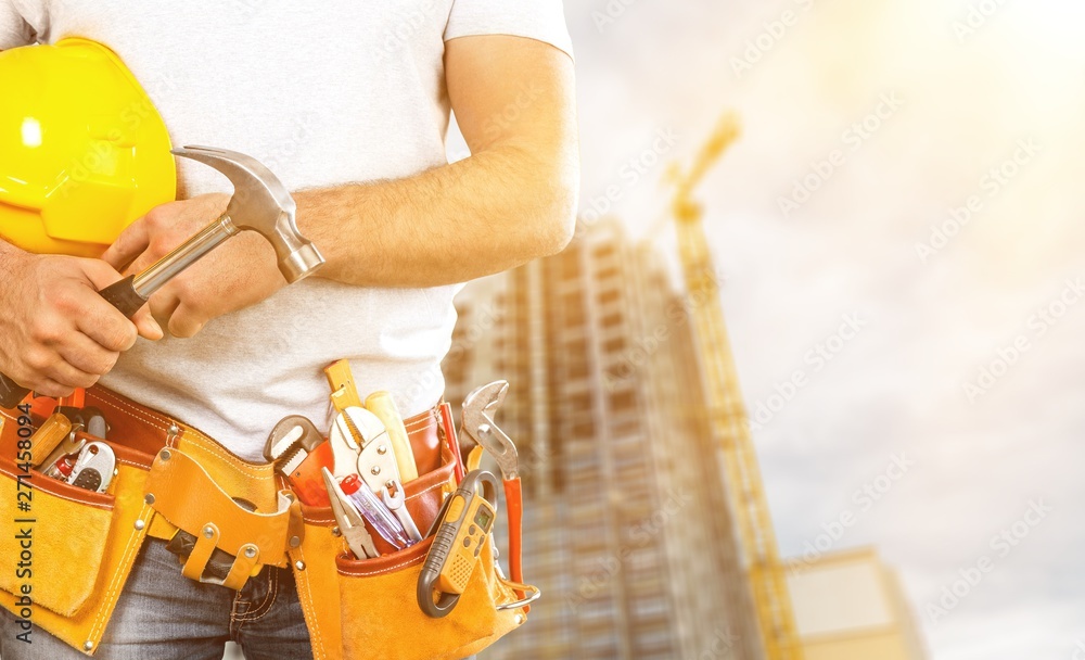 Worker with a tool belt. Isolated over Worker with a tool belt. Isolated over