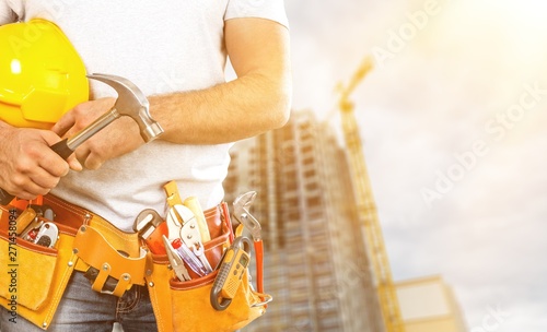 Worker with a tool belt. Isolated over