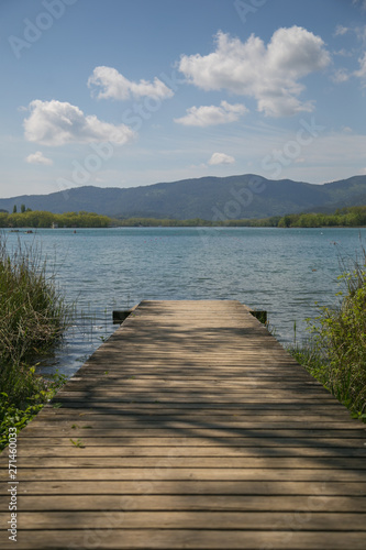 Wooden pathway and jetty in the lake.