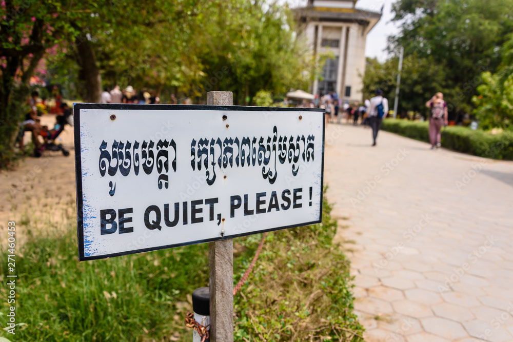 Sign asking visitors to show respect by being quiet at the Choeung Ek Killing Fields Genocide Centre, Phnom Penh, Cambodia