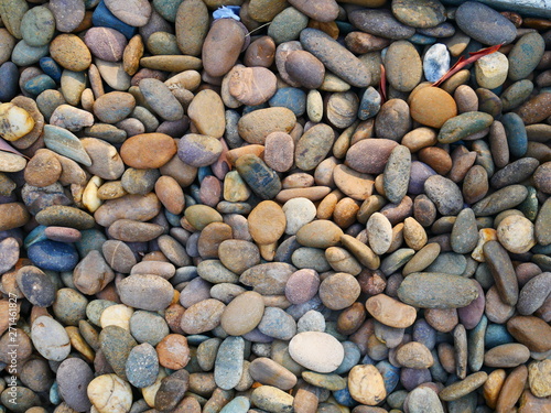 smooth pebbles beach background, brown stone