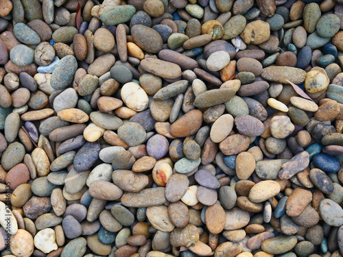 smooth pebbles beach background, brown stone