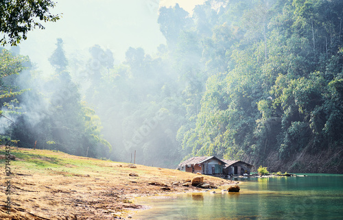 Wooden bungalows in Khao Sok National Park, Surat Thani, Cheow Lan Lake. Beautiful landscape with lake in jungle. photo