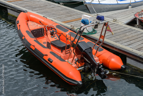 inflatable motor boat moored at a wooden piers