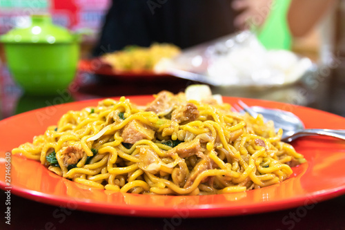 Indonesian stir-fried noodles (Bakmi Goreng) with chicken or seafood, a street-food noodle classic from Java island.  photo