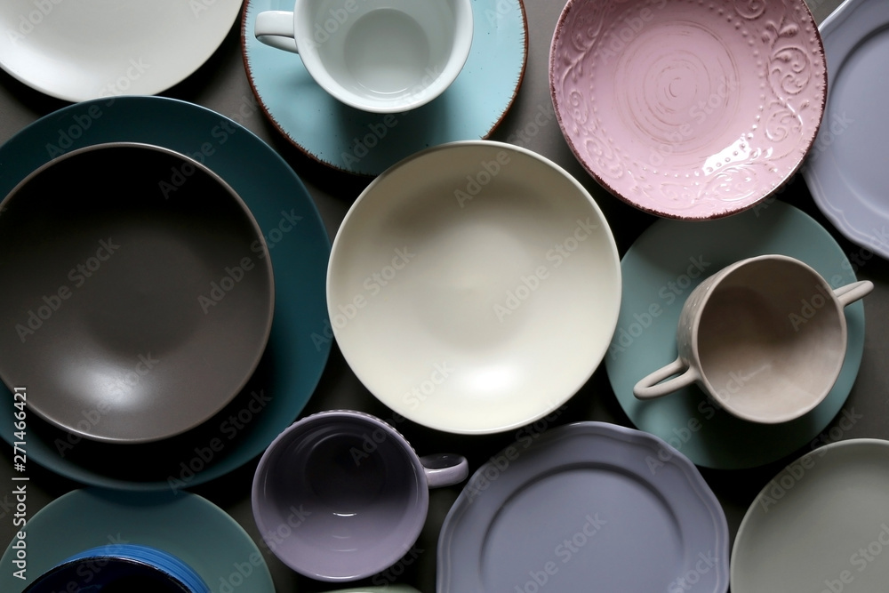 Collection of pottery and kitchenware in muted pastel colors. Top view. Collection of pottery and kitchenware in muted pastel colors. Top view.