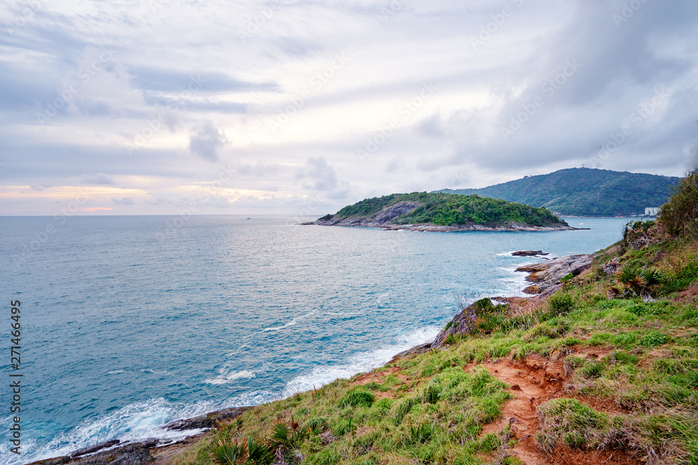 Beautiful landscape with ocean shore, green hill, cloudy sky. Phuket, Thailand. Beautiful landscape with ocean shore, green hill, cloudy sky. Phuket, Thailand.