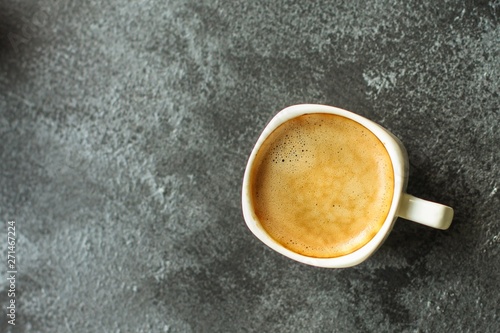 coffee in a white cup. food background. top