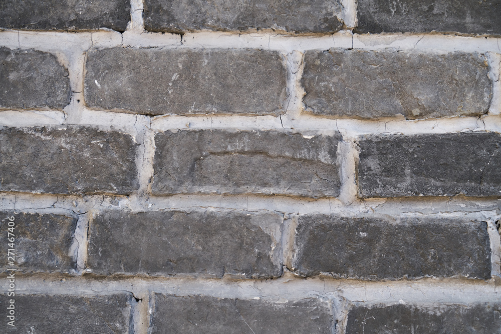 Fototapeta premium Gray brick wall with white seams