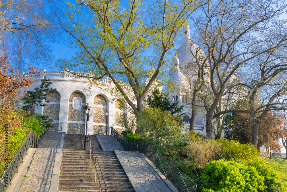 Paris, romantic staircase, and the basilica Sacre-Coeur in background Paris, romantic staircase, and the basilica Sacre-Coeur in background