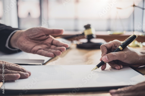 Tableau sur toile Consultation and conference of professional businesswoman and Male lawyers working and discussion having at law firm in office