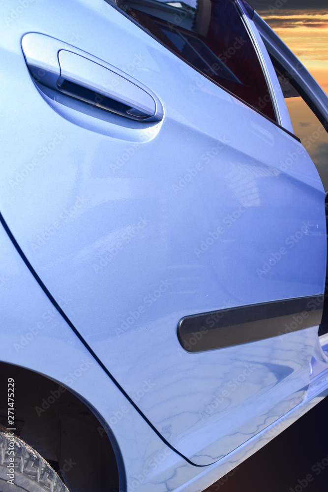 The back door of the car. Background picture of a vehicle designed for human movement,фрагмент. The back door of the car. Background picture of a vehicle designed for human movement,фрагмент.