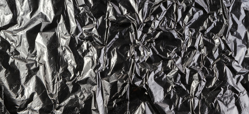 Black dark silver crumpled plastic material texture background Black dark silver crumpled plastic material texture background