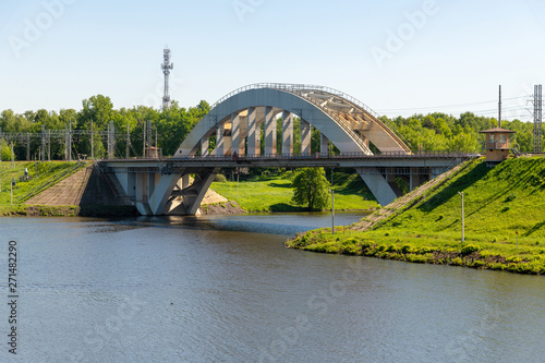 Railway bridge over the river in Khimki city, Russia © olgavolodina