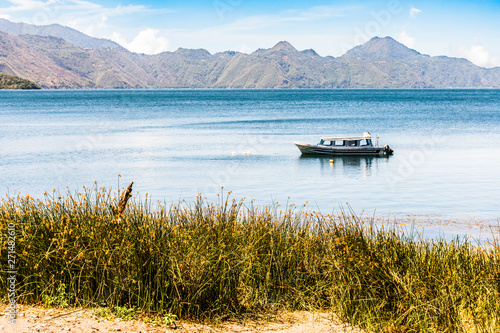 Moored boat on Lake Atitlan, Guatemala photo