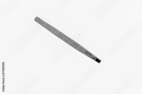 metal tweezers on white background
