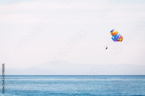 Parasailing at the mediterranean sea - extreme water sports and entertainment concept