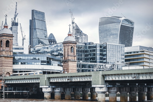 ity of London one of the leading centers of global finance and Canary Wharf at the background.  photo