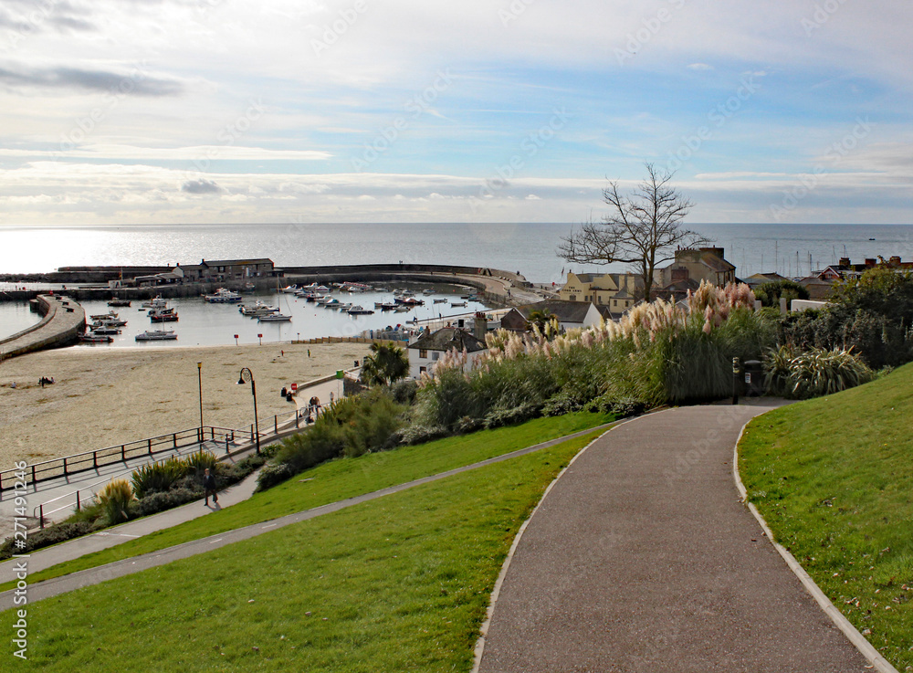Walking down through the park to the Cobb at Lyme Regis in Dorset, England.