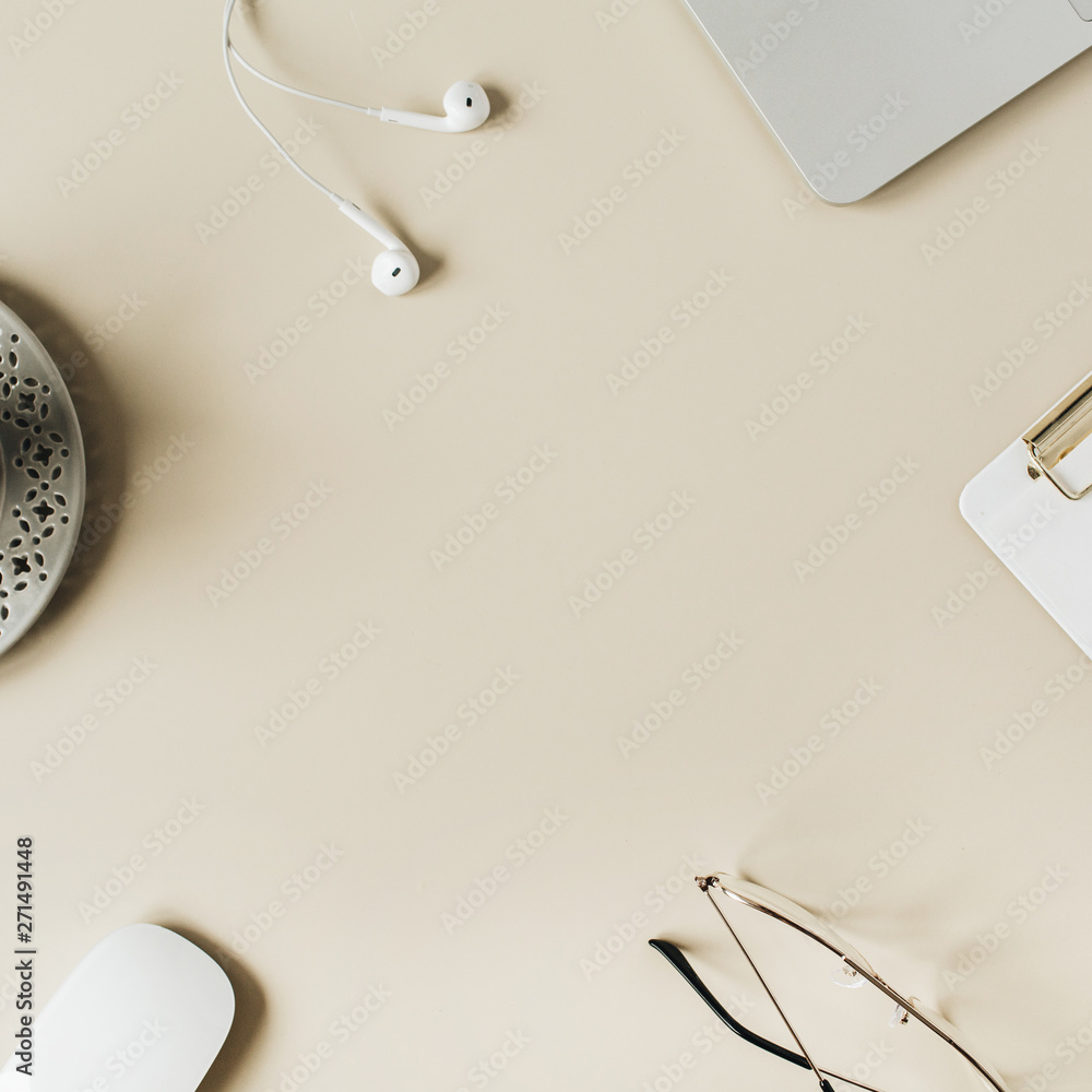 Round frame blank copy space mock up home office desk workspace with laptop, clipboard, headphones, coffee on beige background. Flat lay, top view modern minimalist blog hero header template. Round frame blank copy space mock up home office desk workspace with laptop, clipboard, headphones, coffee on beige background. Flat lay, top view modern minimalist blog hero header template.