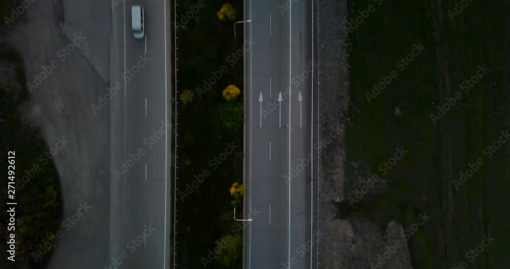Aerial Shot Of A Highway Across The Forest In The Evening Aerial Shot Of A Highway Across The Forest In The Evening