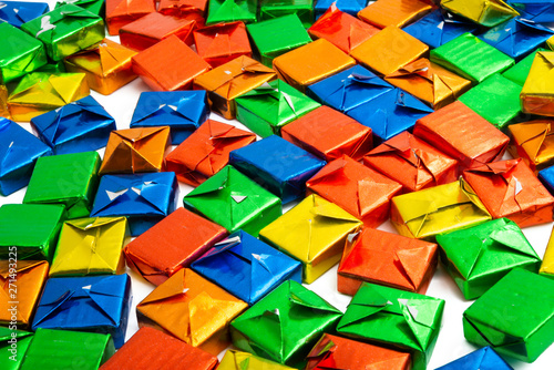 candy in a multi-colored wrapper isolated