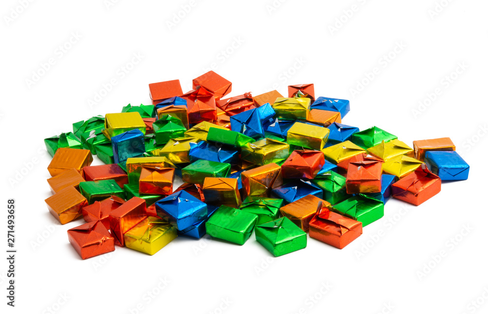 candy in a multi-colored wrapper isolated candy in a multi-colored wrapper isolated