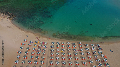 Aerial drone top view photo of turquoise organised beach forming a small heart shaped lagoon and mountainous seascape of Stavros  Chania  Crete island  Greece