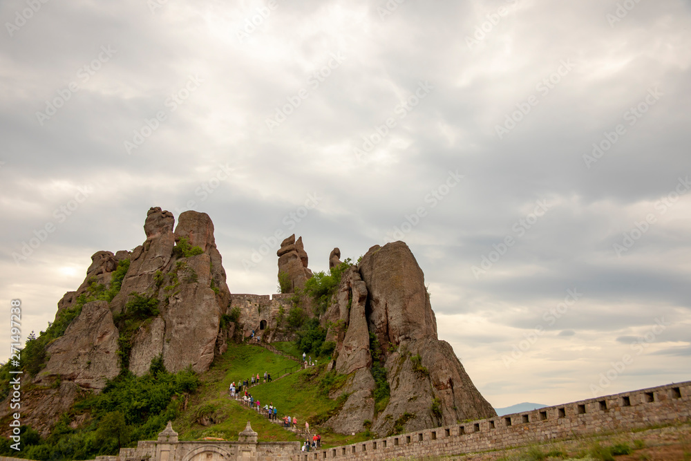 Tourists climbing fortress of Belogradchik Rocks Bulgaria