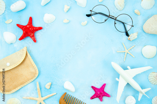 Flat lay mockup with glasses, seashells and beach accessories. Summer frame with copy space for text