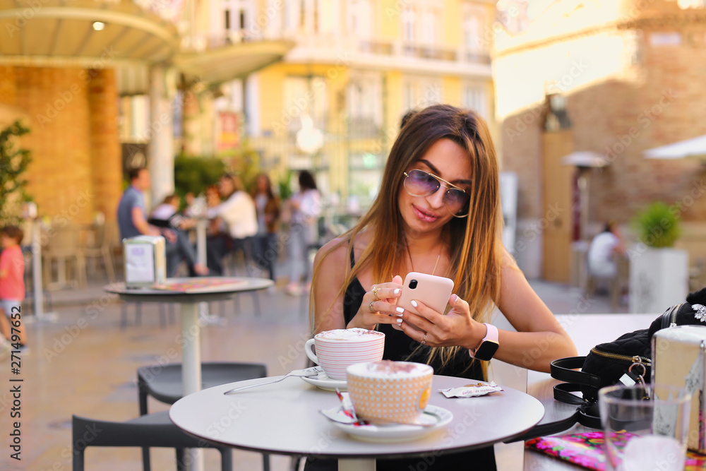 happy Girl seat in caffe ant talk on phone happy Girl seat in caffe ant talk on phone