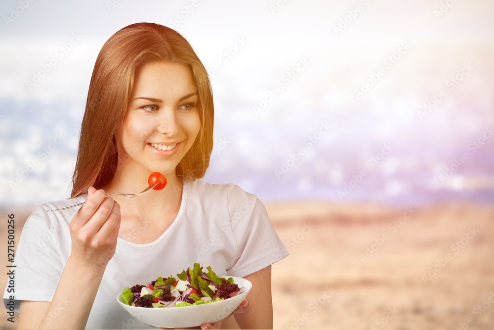 Attractive caucasian woman with salad on background Attractive caucasian woman with salad on background