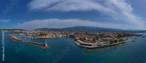 Fototapeta Naklejka Na Ścianę i Meble -  Aerial drone panoramic view of iconic and picturesque Venetian old port of Chania with famous landmark lighthouse and traditional character, Crete island, Greece