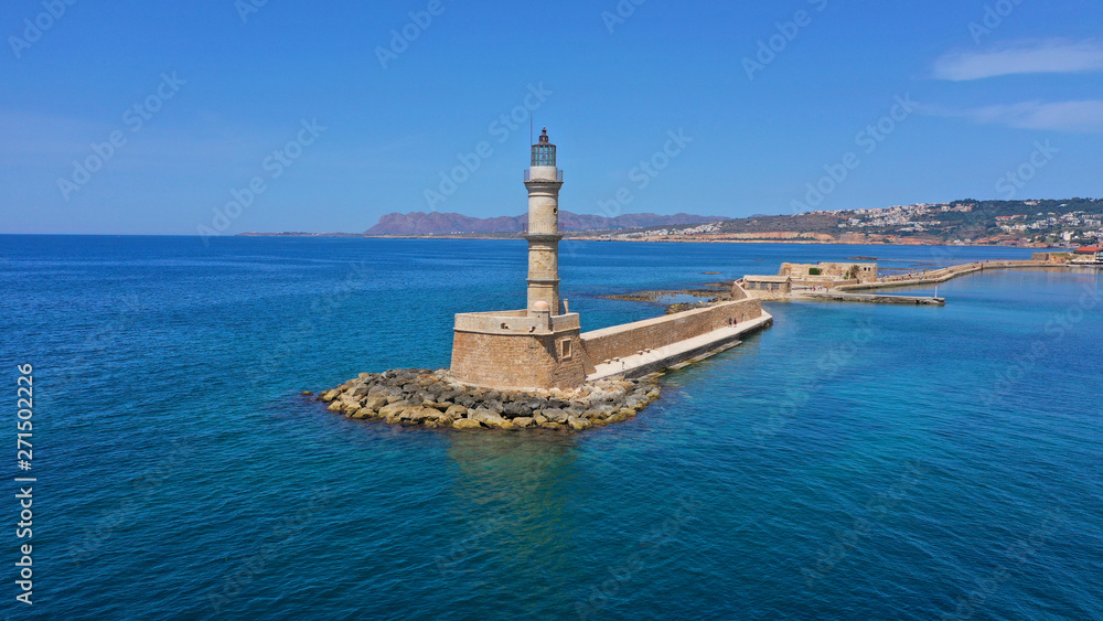 Aerial drone panoramic view of iconic and picturesque Venetian old port of Chania with famous landmark lighthouse and traditional character, Crete island, Greece