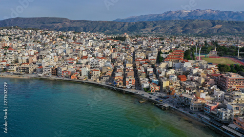 Aerial drone panoramic view of iconic and picturesque Venetian old port of Chania with famous landmark lighthouse and traditional character, Crete island, Greece