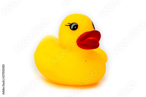 Rubber bath duck isolated on white. A side view of a yellow rubber duck.