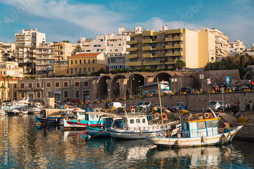 heraklion city port view. boats sea reflection clear day summer freedom vintage