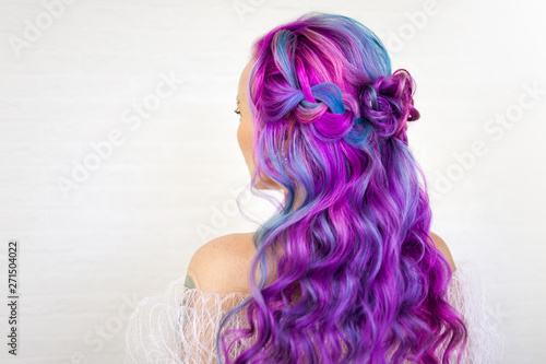 Charming young fashionista with stylish hair. Colored hair