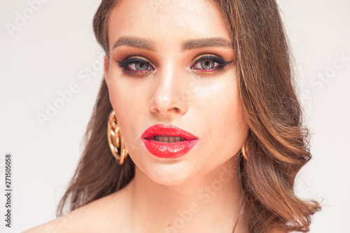 Eyelashes Makeup. Woman Beauty Face With Black Lashes Extensions and Red Lips